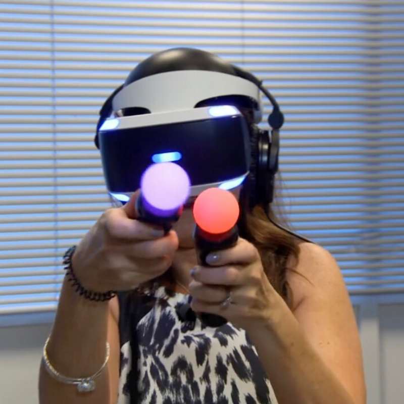 woman with VR controllers and headset